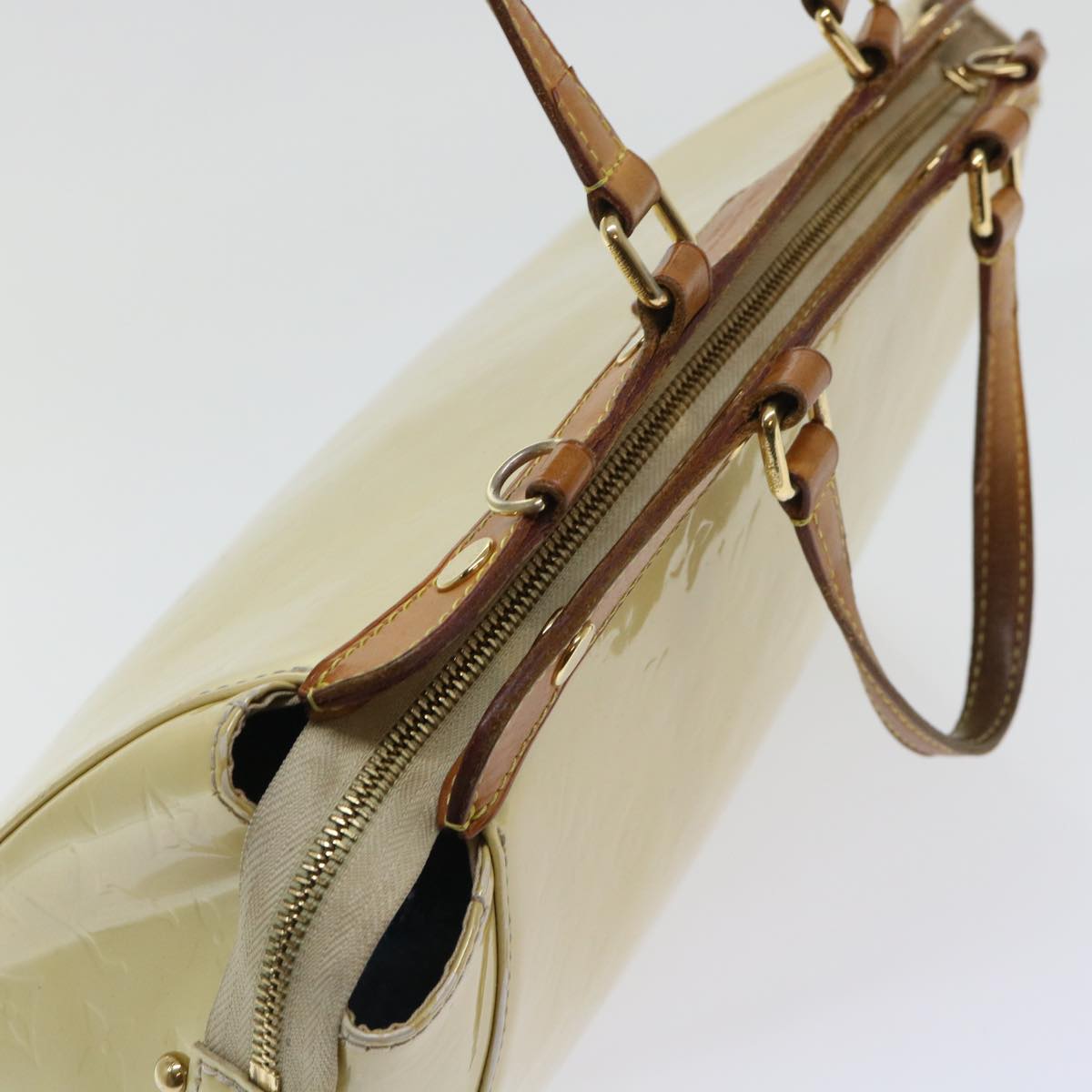 Sophisticated Beige Patent Leather Handbag