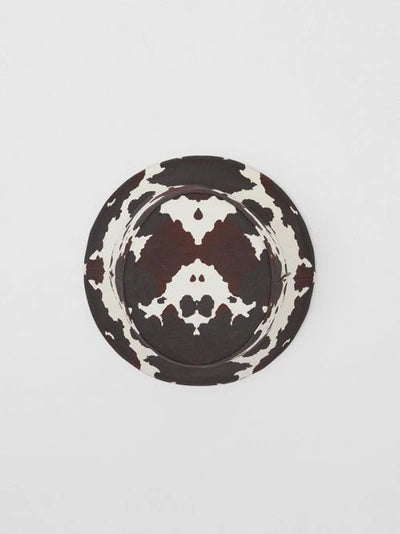 BURBERRY LOGO PATCH COW PRINT BUCKET HAT
