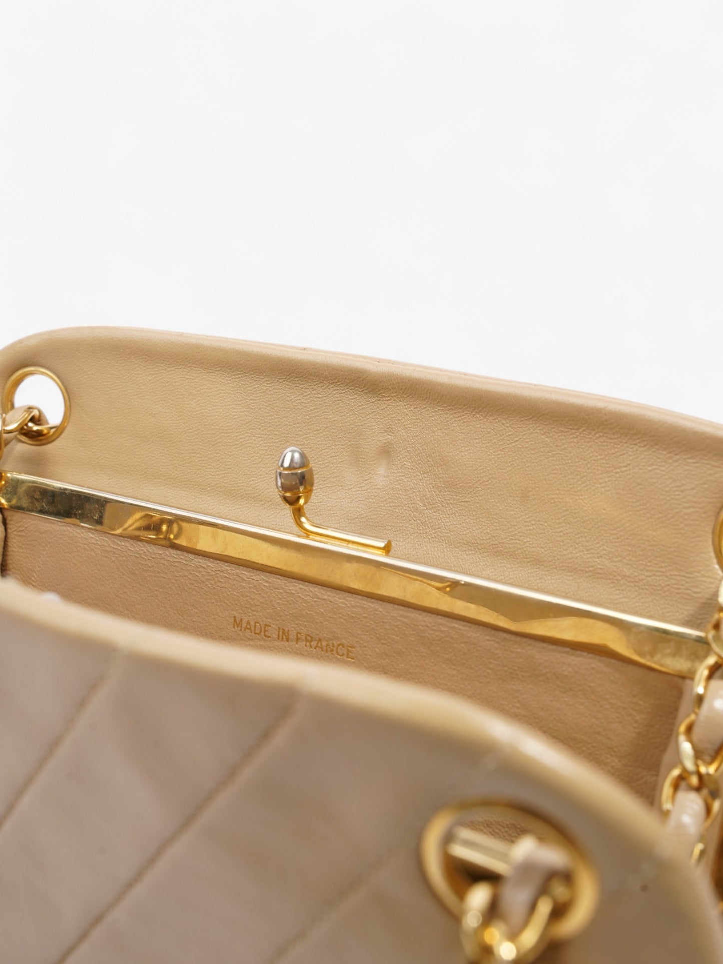 Chanel Kiss Lock Beige Lambskin Leather
