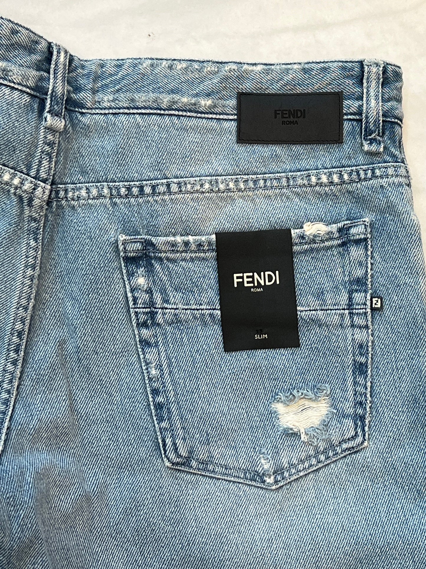 FENDI DISTRESSED FF LOGO JEANS