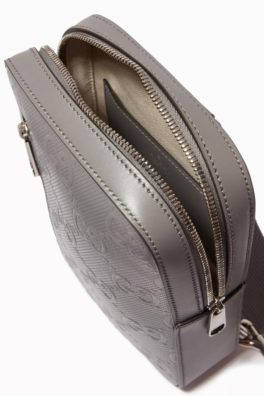 GUCCI GG EMBOSSED LEATHER SLINGBAG