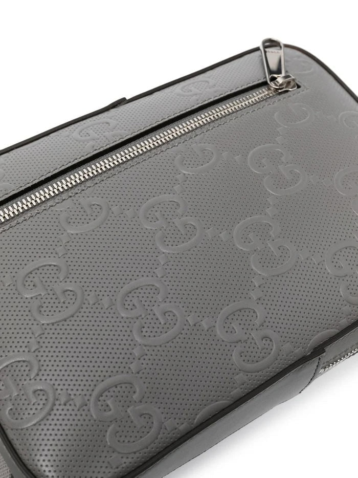 GUCCI GG EMBOSSED LEATHER SLINGBAG