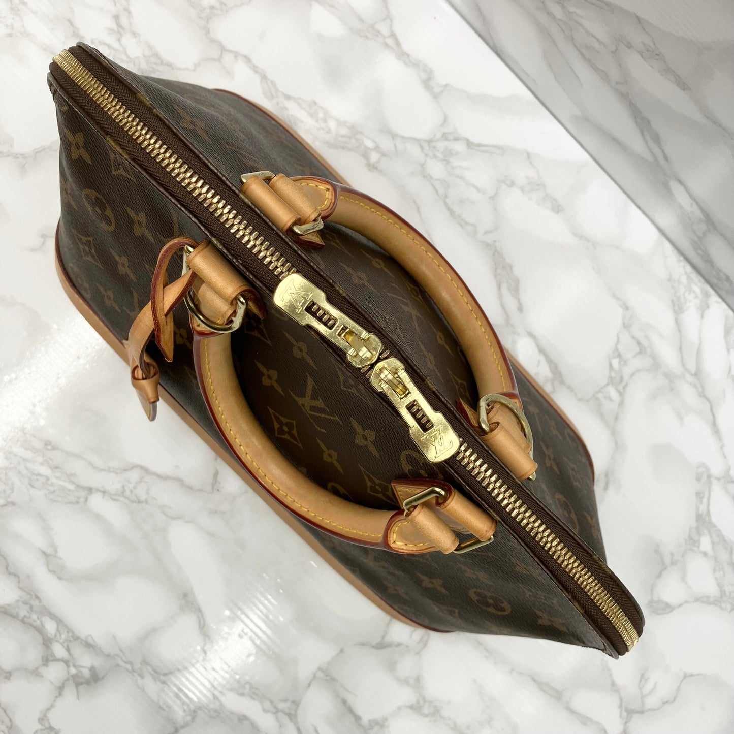 LOUIS VUITTON Monogram Alma PM Handbag