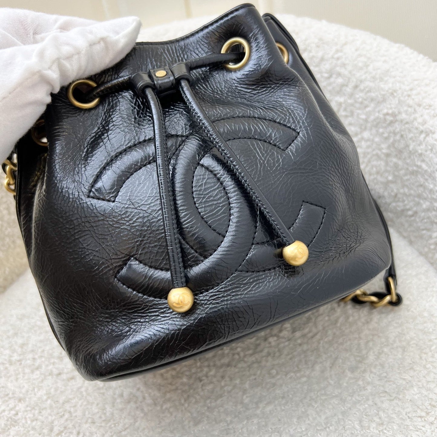 GLM-Mini Drawstring Bucket Bag in Glossy Distressed Black Calfskin and AGHW