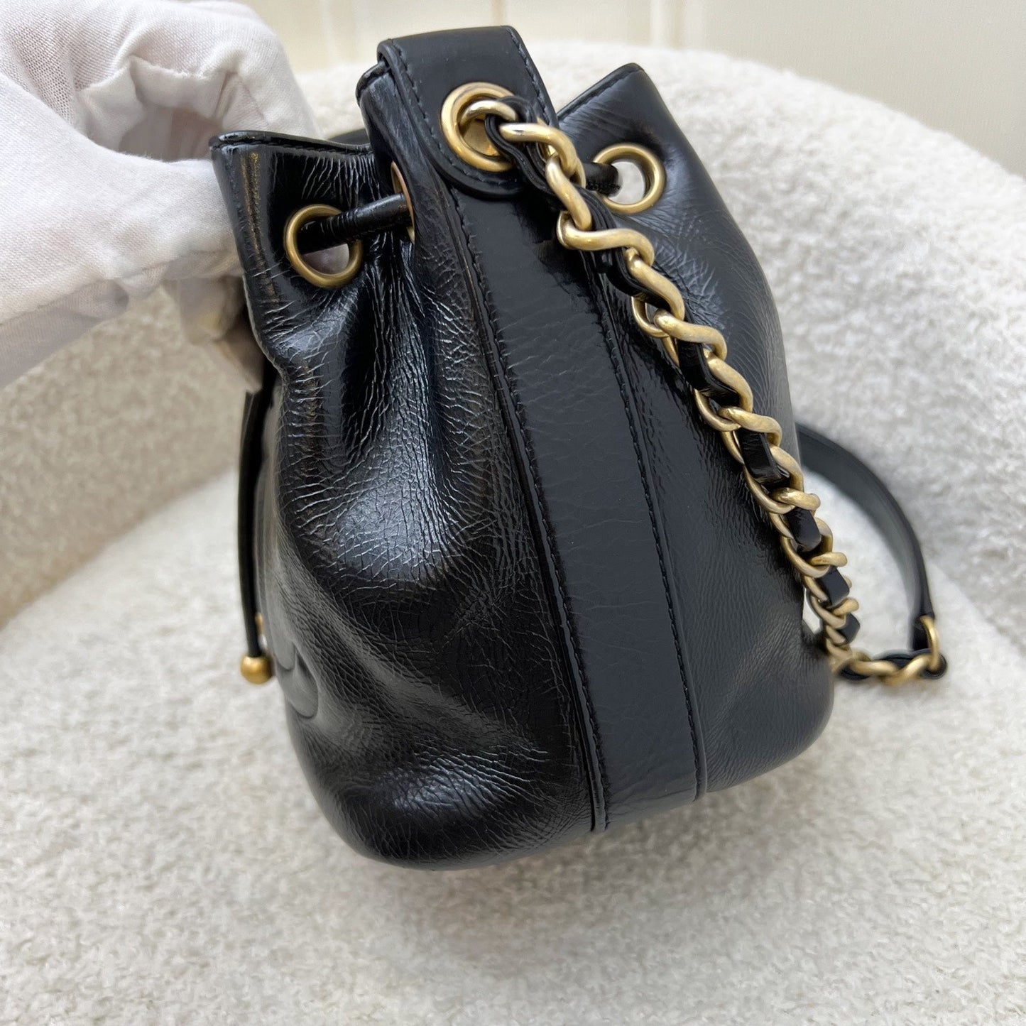 GLM-Mini Drawstring Bucket Bag in Glossy Distressed Black Calfskin and AGHW