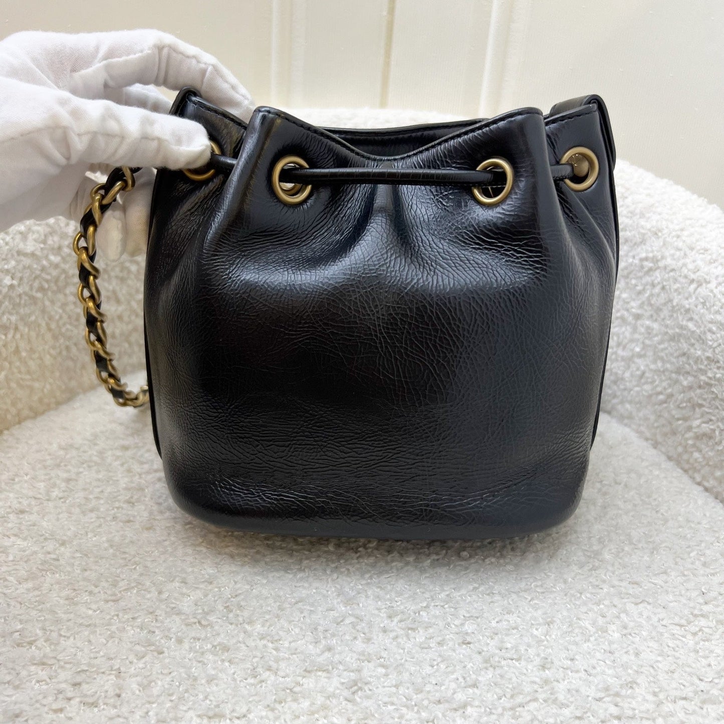 GLM-Mini Drawstring Bucket Bag in Glossy Distressed Black Calfskin and AGHW