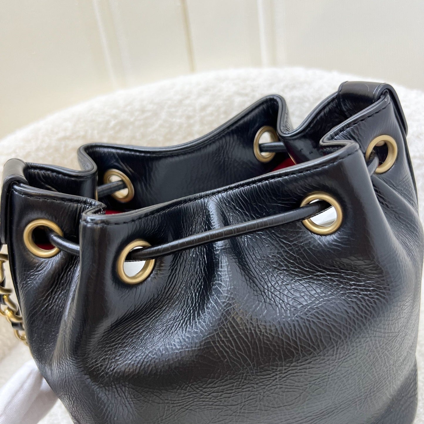 GLM-Mini Drawstring Bucket Bag in Glossy Distressed Black Calfskin and AGHW
