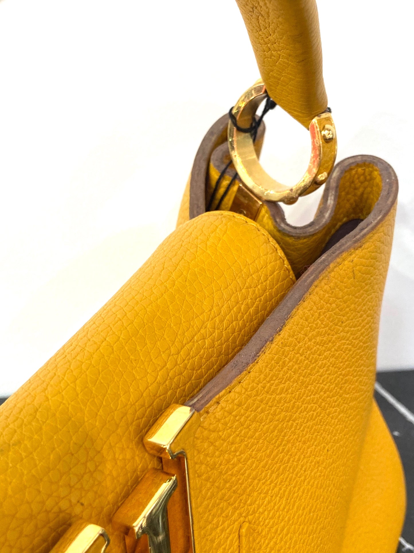 LOUIS VUITTON TAURILLON CAPUCINES MM HANDBAG TOURENESOL