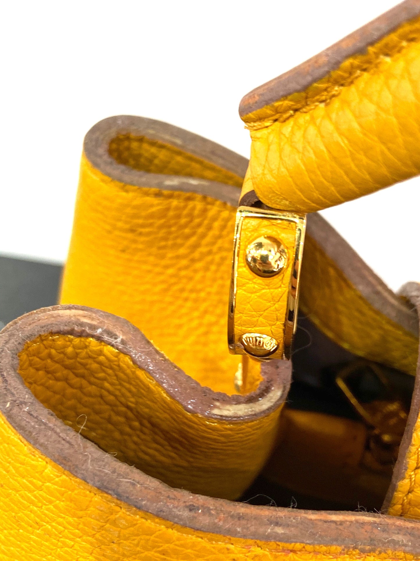 LOUIS VUITTON TAURILLON CAPUCINES MM HANDBAG TOURENESOL