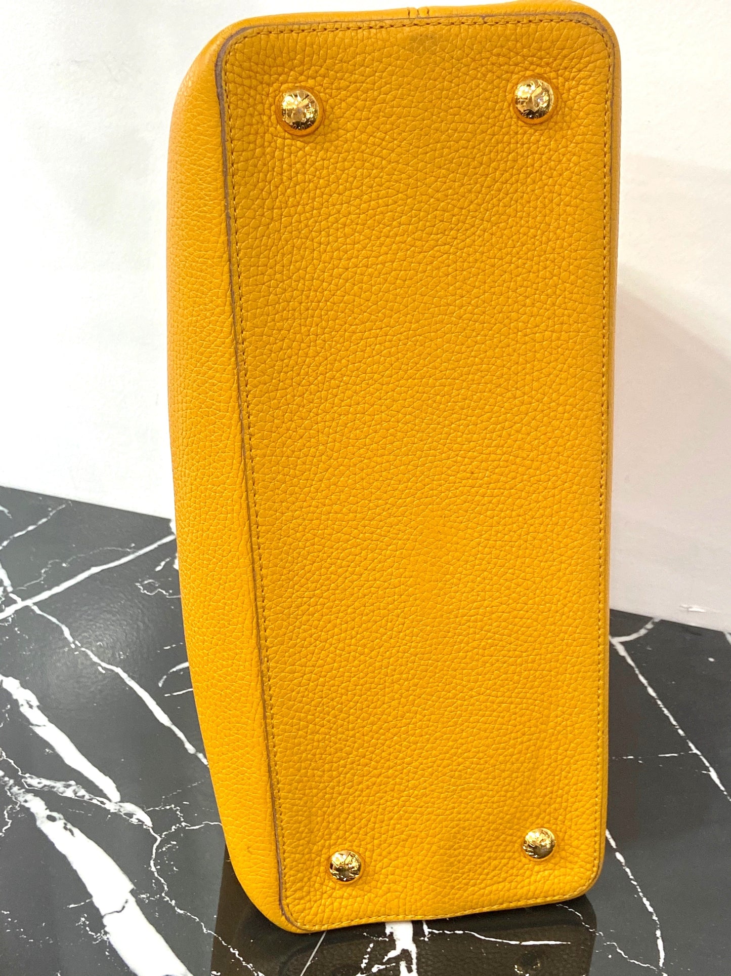 LOUIS VUITTON TAURILLON CAPUCINES MM HANDBAG TOURENESOL
