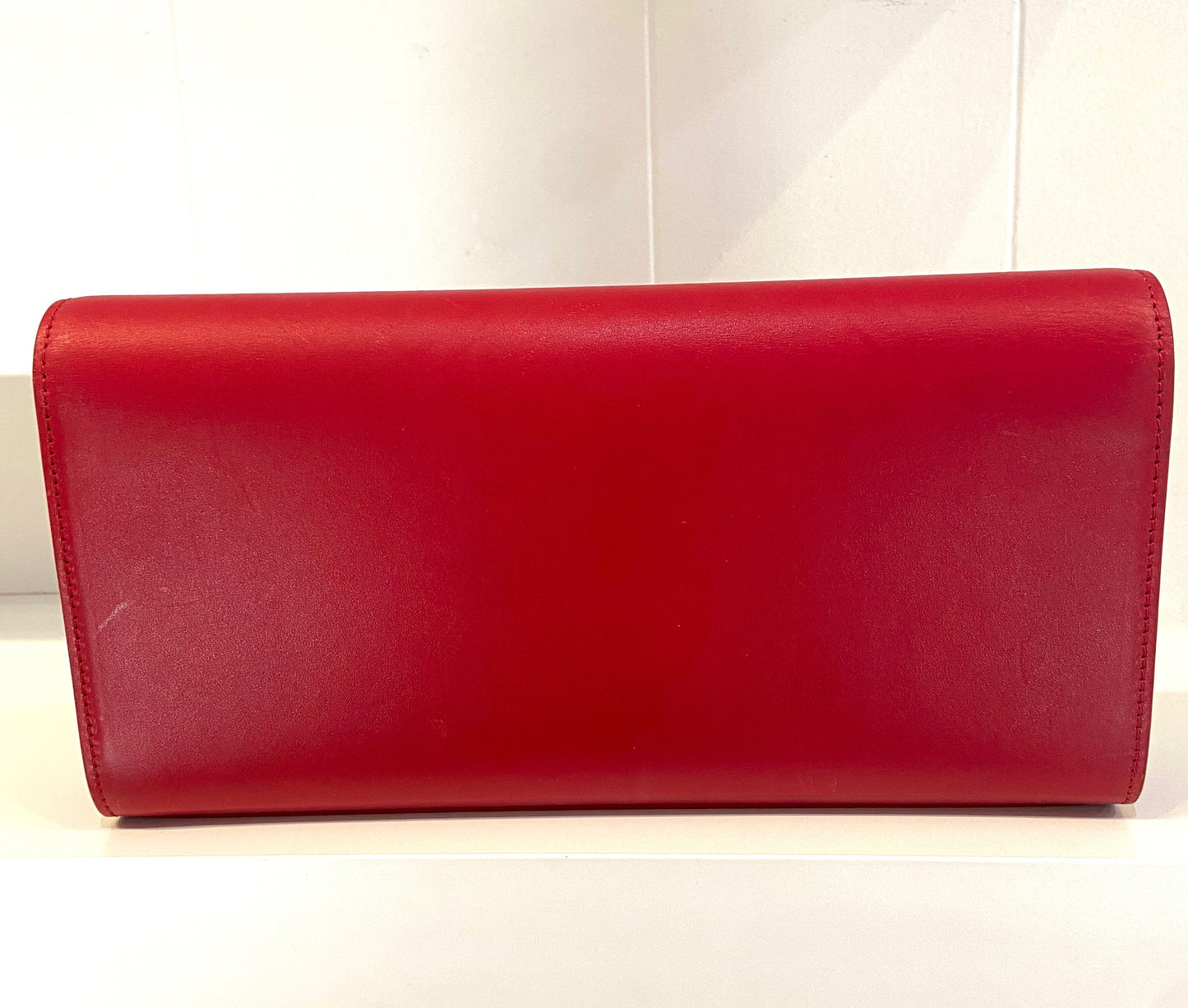 YVES SAINT LAURENT KATE LEATHER CLUTCH BAG ROUGE