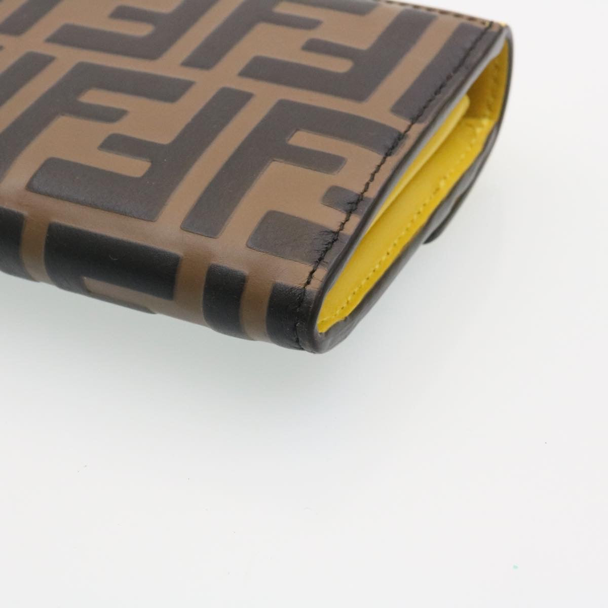FENDI Zucca F is Continental Wallet Embossed Leather Yellow Brown 34531